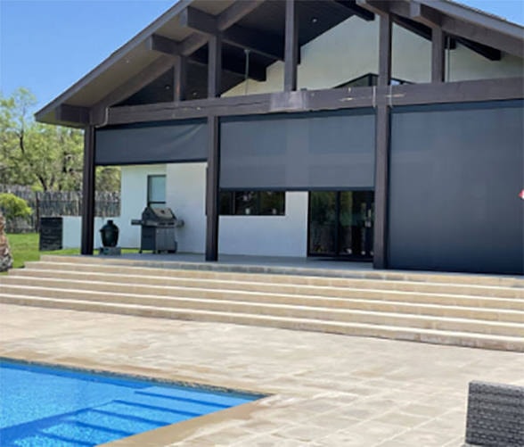 Magnatrack motorized screens on a modern home with pool and patio